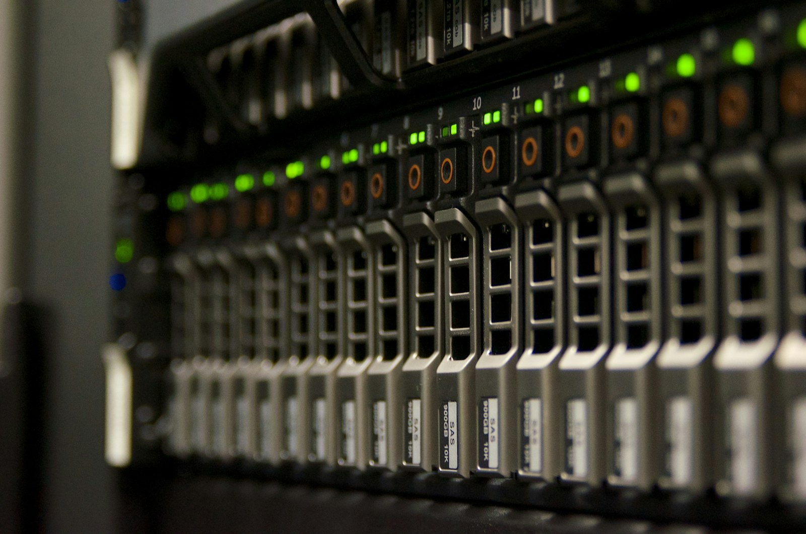 Front view of a populated enterprise server rack with rows of green status LEDs